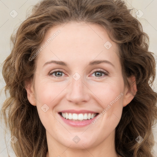 Joyful white young-adult female with long  brown hair and green eyes