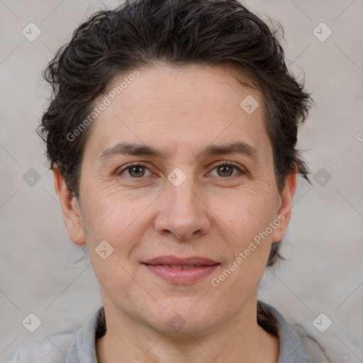 Joyful white adult female with short  brown hair and brown eyes