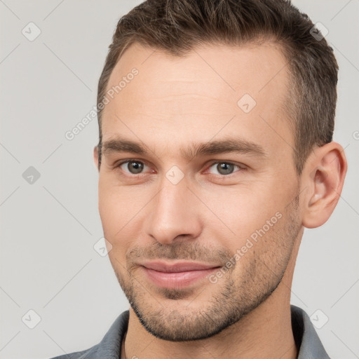 Joyful white young-adult male with short  brown hair and brown eyes