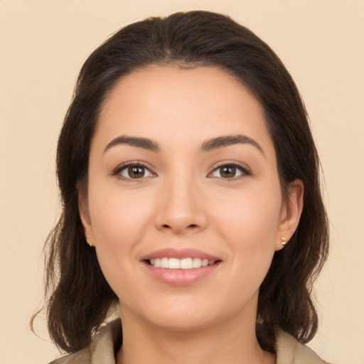 Joyful white young-adult female with medium  brown hair and brown eyes