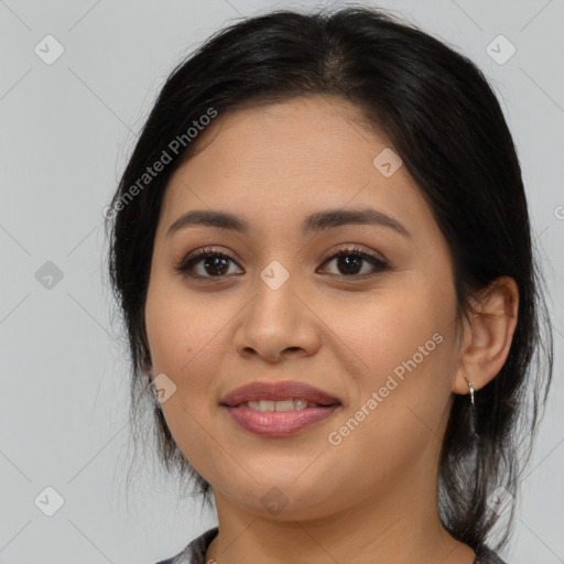 Joyful latino young-adult female with medium  brown hair and brown eyes