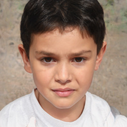 Joyful white child male with short  brown hair and brown eyes