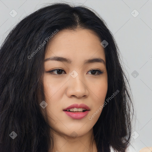 Joyful asian young-adult female with long  brown hair and brown eyes