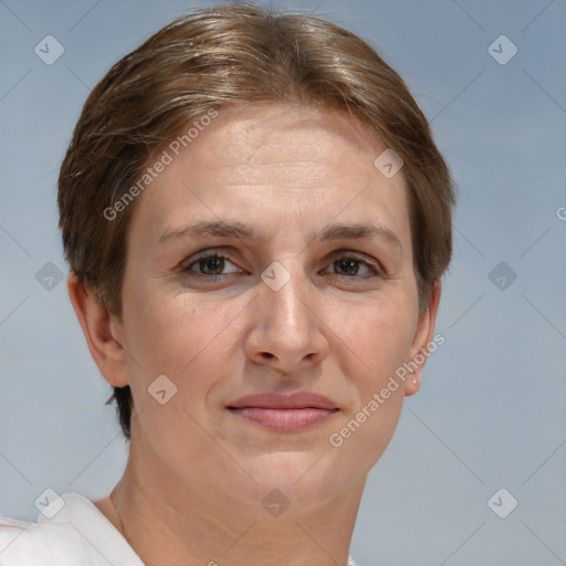 Joyful white adult female with short  brown hair and grey eyes