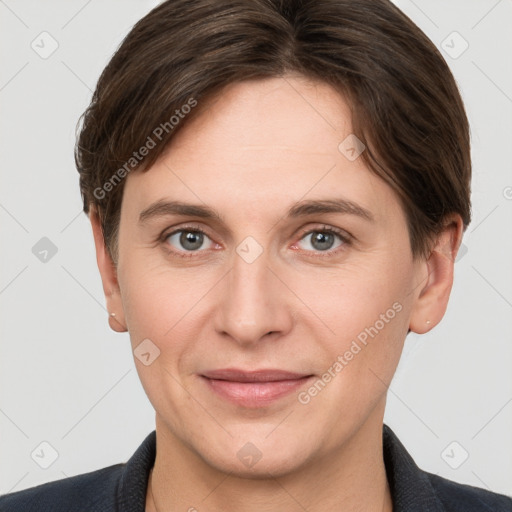 Joyful white adult female with short  brown hair and grey eyes