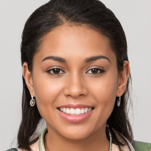 Joyful white young-adult female with long  brown hair and brown eyes