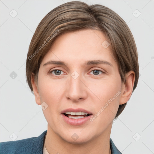 Joyful white young-adult female with short  brown hair and grey eyes