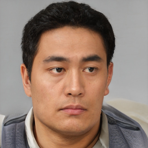 Neutral asian young-adult male with short  black hair and brown eyes