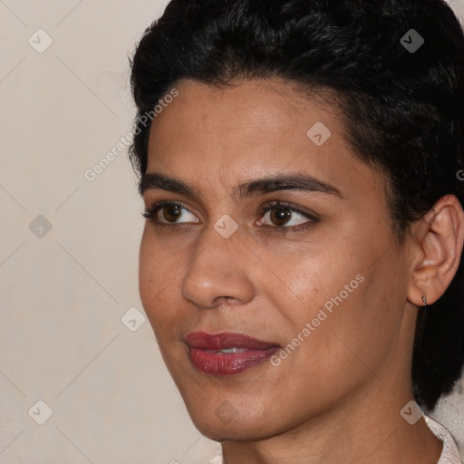 Joyful latino young-adult female with short  brown hair and brown eyes