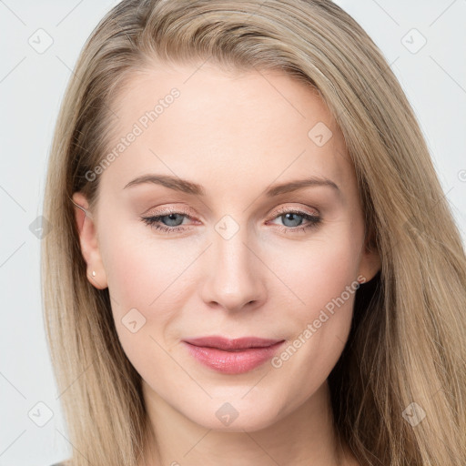 Joyful white young-adult female with long  brown hair and blue eyes