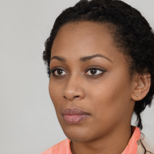 Neutral black young-adult female with long  black hair and brown eyes