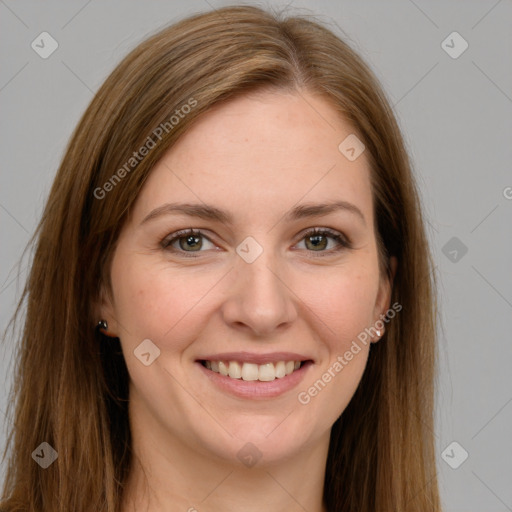 Joyful white young-adult female with long  brown hair and green eyes