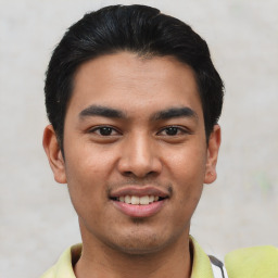 Joyful asian young-adult male with short  black hair and brown eyes