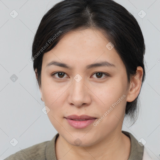 Joyful asian young-adult female with medium  brown hair and brown eyes