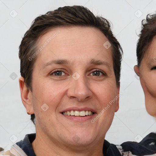 Joyful white adult female with short  brown hair and brown eyes