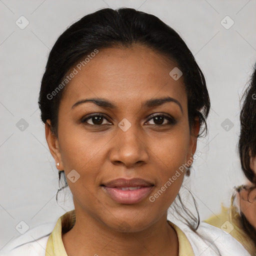 Joyful black young-adult female with medium  brown hair and brown eyes