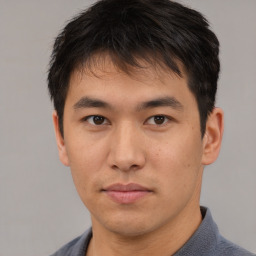 Neutral asian young-adult male with short  brown hair and brown eyes