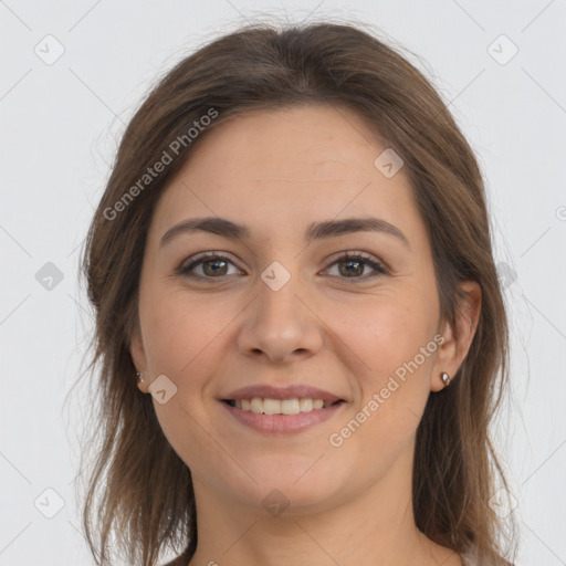 Joyful white young-adult female with long  brown hair and brown eyes