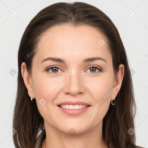 Joyful white young-adult female with long  brown hair and brown eyes