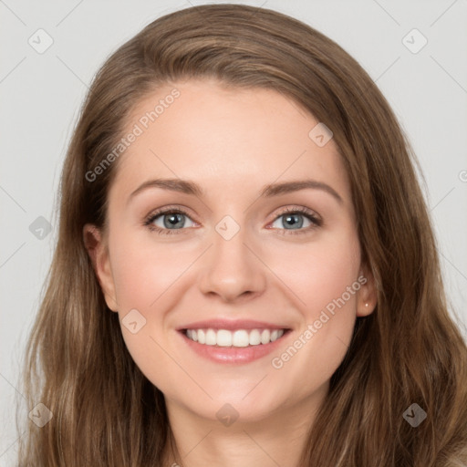 Joyful white young-adult female with long  brown hair and green eyes