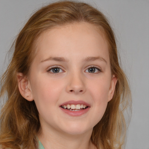 Joyful white child female with medium  brown hair and blue eyes