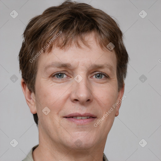 Joyful white adult male with short  brown hair and grey eyes