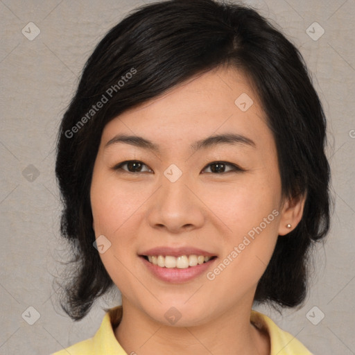 Joyful asian young-adult female with medium  brown hair and brown eyes