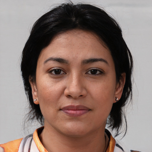 Joyful white young-adult female with medium  black hair and brown eyes