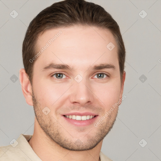 Joyful white young-adult male with short  brown hair and grey eyes