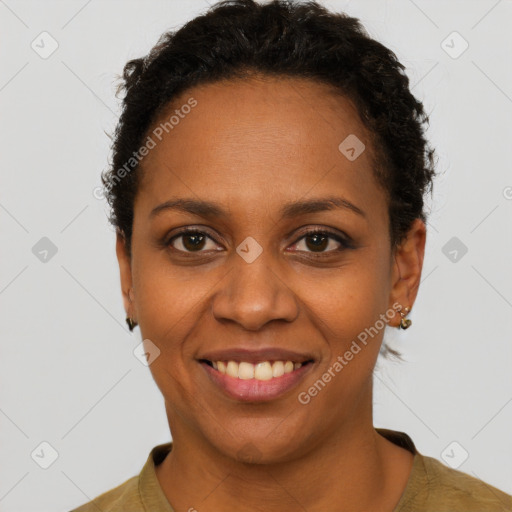 Joyful black young-adult female with short  brown hair and brown eyes