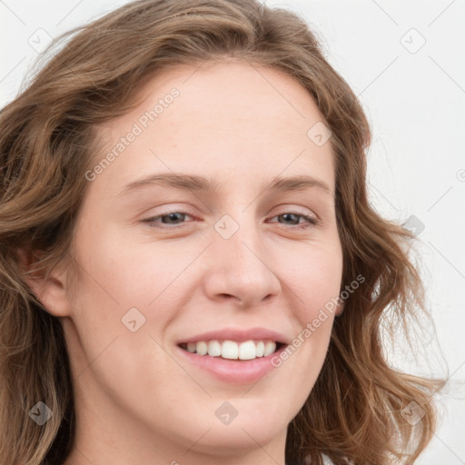 Joyful white young-adult female with long  brown hair and blue eyes