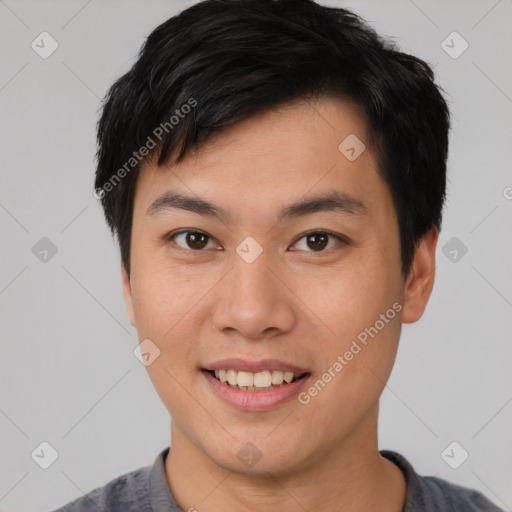 Joyful asian young-adult male with short  brown hair and brown eyes