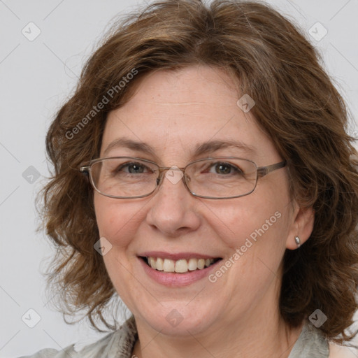 Joyful white adult female with medium  brown hair and blue eyes