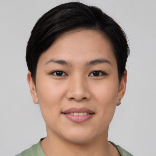 Joyful asian young-adult female with short  brown hair and brown eyes