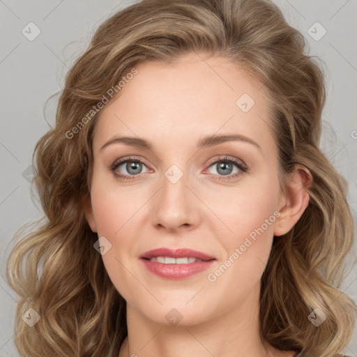 Joyful white young-adult female with long  brown hair and green eyes