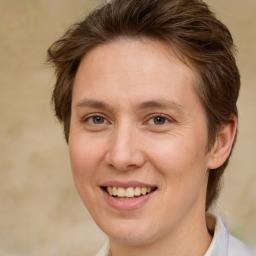 Joyful white adult female with medium  brown hair and brown eyes