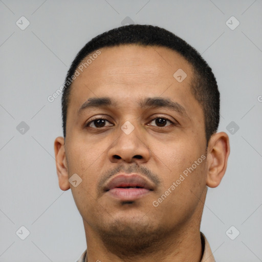 Neutral latino young-adult male with short  black hair and brown eyes