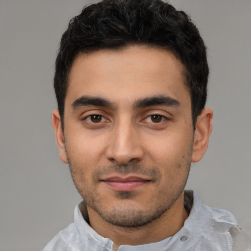 Neutral latino young-adult male with short  black hair and brown eyes