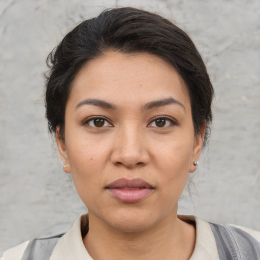 Joyful white young-adult female with short  brown hair and brown eyes