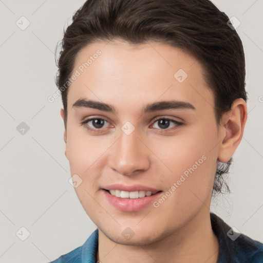 Joyful white young-adult female with short  brown hair and brown eyes