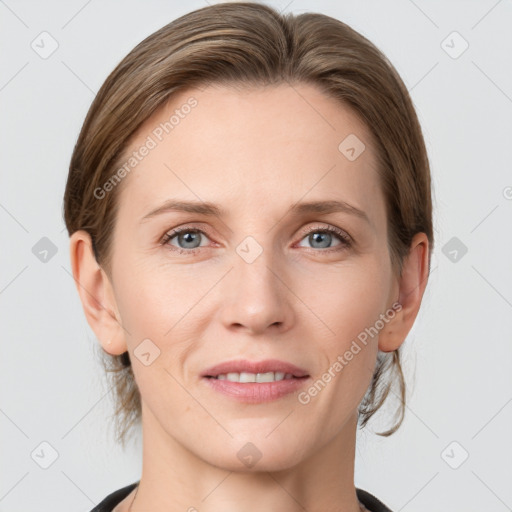 Joyful white young-adult female with medium  brown hair and grey eyes