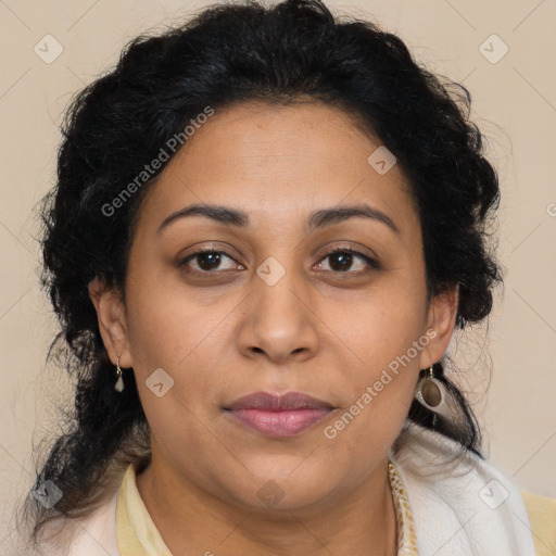 Joyful latino adult female with medium  brown hair and brown eyes