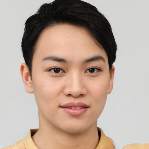Joyful asian young-adult female with short  black hair and brown eyes