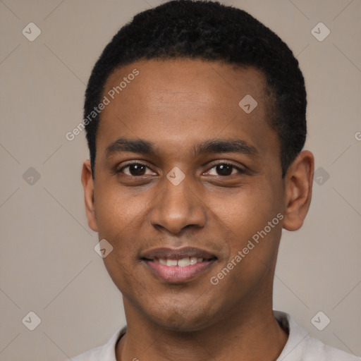 Joyful black young-adult male with short  black hair and brown eyes