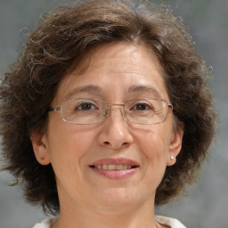 Joyful white middle-aged female with medium  brown hair and brown eyes