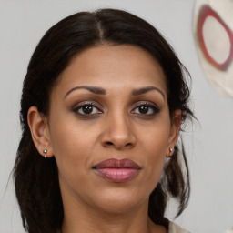 Joyful black young-adult female with medium  brown hair and brown eyes