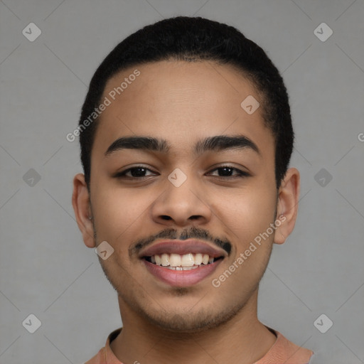 Joyful latino young-adult male with short  black hair and brown eyes