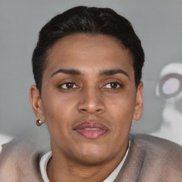 Joyful latino young-adult male with short  brown hair and brown eyes