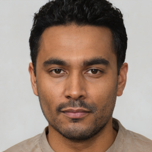 Neutral latino young-adult male with short  black hair and brown eyes