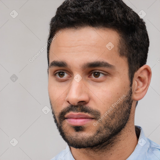 Neutral white young-adult male with short  black hair and brown eyes